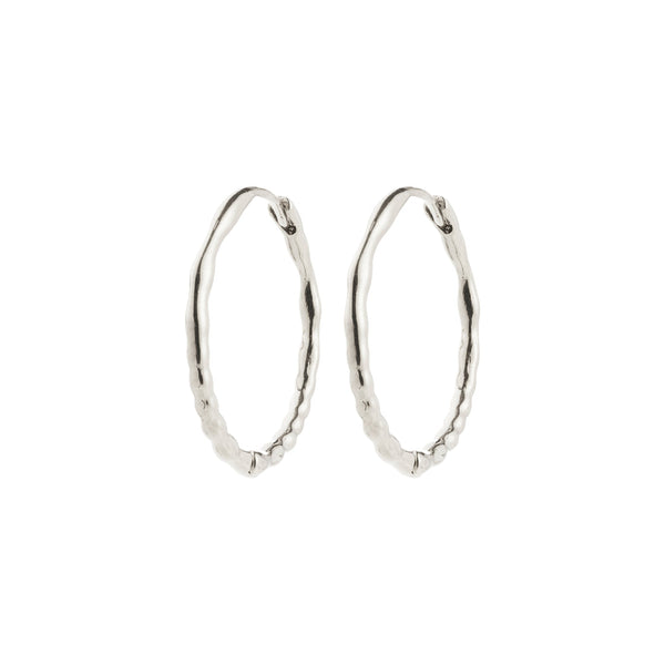 BETWEEN silver-plated creoles