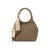 Maison Taïga taupe pebbled leather handbag with a rounded top handle and a decorative patterned silk scarf accessory